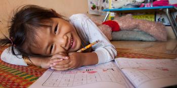 Girl doing homework, A habitat for learning, Habitat for Humanity